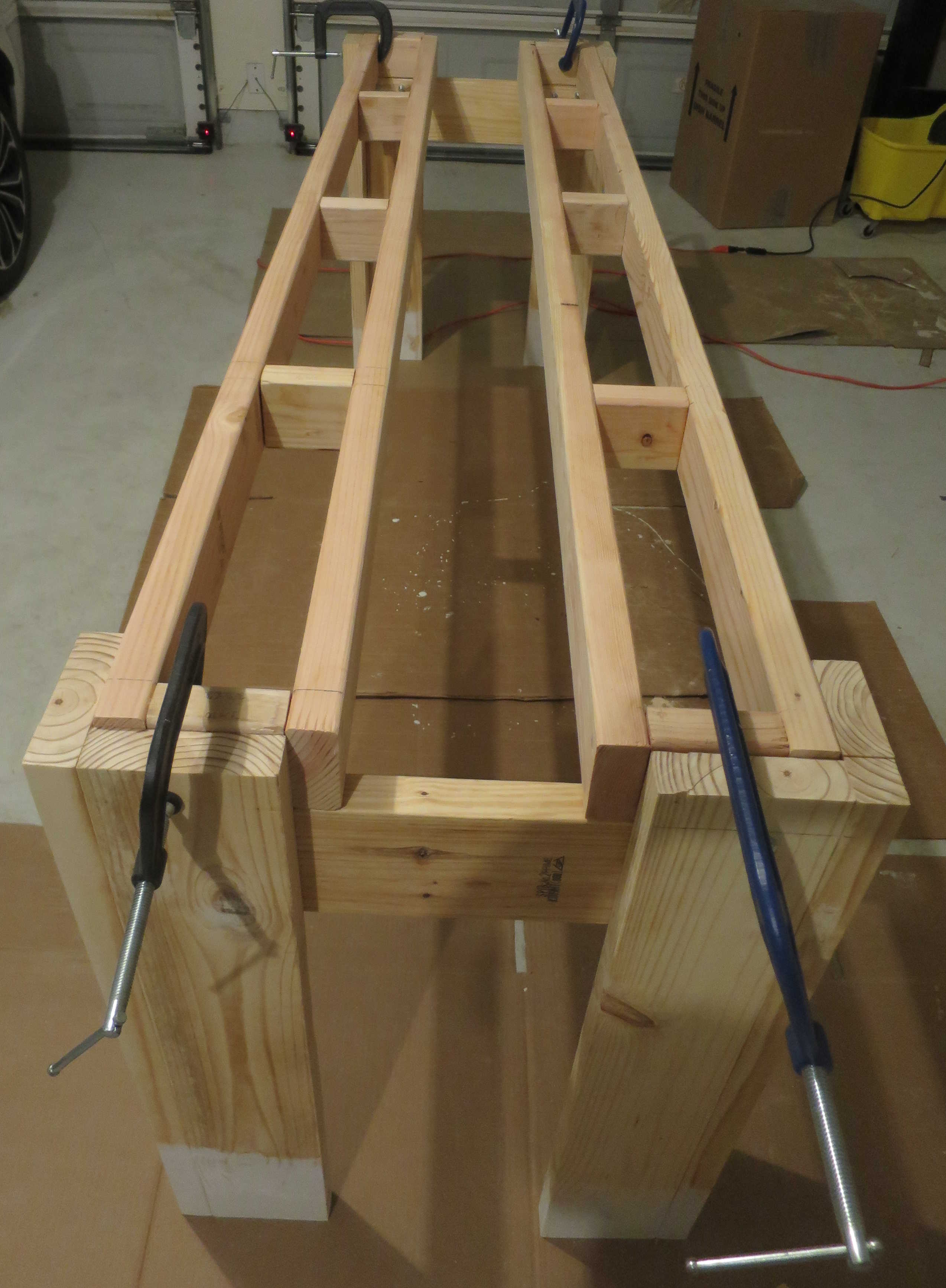 Side View Both Table Legs clamped to main beams